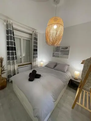 Un ou plusieurs lits dans un hébergement de l'établissement Le Bohème - Centre Ville, Netflix et WIFI, parking, idéal familles, couples et voyages d'affaire