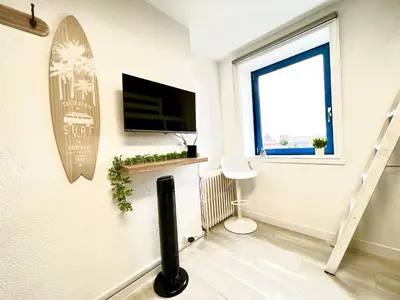 Télévision ou salle de divertissement dans l'établissement Studio cosy Bali 1 à 4 pers porte du Futuroscope