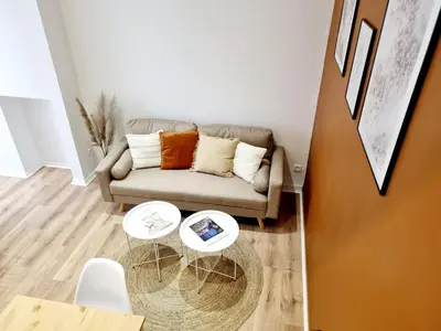 Coin salon dans l'établissement Meublés du chêne vert, cœur de Jarnac