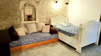 Un ou plusieurs lits dans un hébergement de l'établissement La Fontenelle Chambres d'Hôtes