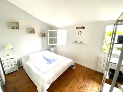 Un ou plusieurs lits dans un hébergement de l'établissement LA MAISON DU BONHEUR