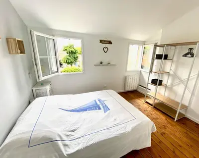 Un ou plusieurs lits dans un hébergement de l'établissement LA MAISON DU BONHEUR