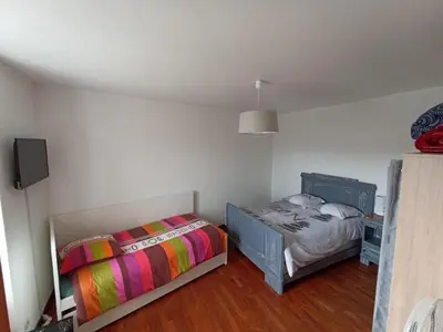 Un ou plusieurs lits dans un hébergement de l'établissement Maison de ville de 95M2