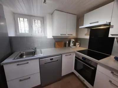 Cuisine ou kitchenette dans l'établissement Maison Cosy