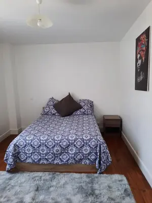 Un ou plusieurs lits dans un hébergement de l'établissement Maison Cosy