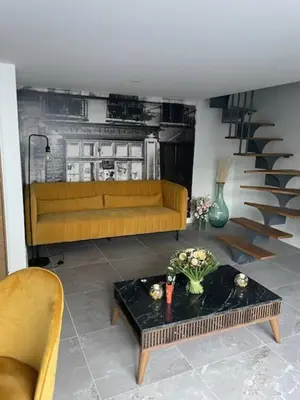 Coin salon dans l'établissement Jolie maison en pierres avec piscine et parking
