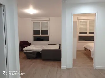Un ou plusieurs lits dans un hébergement de l'établissement AppartHôtel