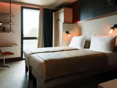 Un ou plusieurs lits dans un hébergement de l'établissement ibis Styles La Rochelle Centre Gare