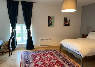 Un ou plusieurs lits dans un hébergement de l'établissement La Maison du Petit Jacques - Mirabelle Cottage