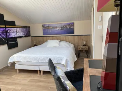 Un ou plusieurs lits dans un hébergement de l'établissement Maison loft