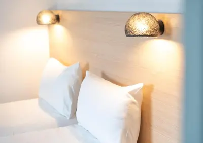 Un ou plusieurs lits dans un hébergement de l'établissement Hôtel Inn Design La Rochelle