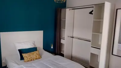 Un ou plusieurs lits dans un hébergement de l'établissement Grand appartement lumineux vue mer