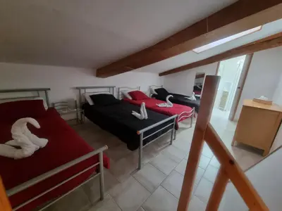 Un ou plusieurs lits dans un hébergement de l'établissement La Maison des Grands Bambous - L'Angoumois L'Aunis La Saintonge La Boutonne