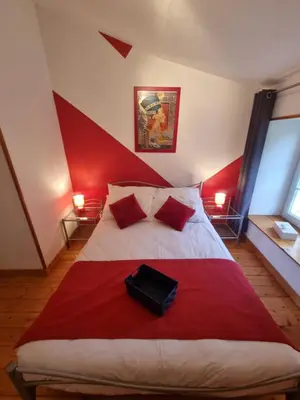 Un ou plusieurs lits dans un hébergement de l'établissement La Maison des Grands Bambous - L'Angoumois L'Aunis La Saintonge La Boutonne