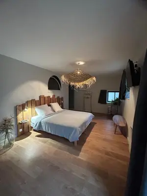 Un ou plusieurs lits dans un hébergement de l'établissement Chambres d'hôtes de la pilatière