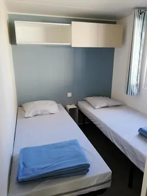 Un ou plusieurs lits dans un hébergement de l'établissement Camping Le Beaulieu