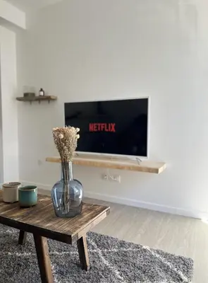Télévision ou salle de divertissement dans l'établissement Appartement situé en plein coeur du centre-ville