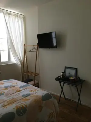 Télévision ou salle de divertissement dans l'établissement La maison de Dom
