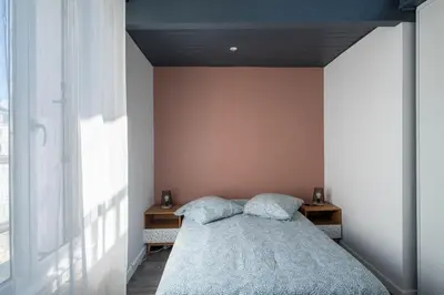 Un ou plusieurs lits dans un hébergement de l'établissement Maison de ville en plein centre avec terrasse