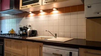 Cuisine ou kitchenette dans l'établissement L'Intemporel - Appartement T3 avec jardinet