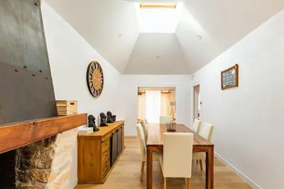 Coin salon dans l'établissement Maison de vacance à 15 minutes de Royan