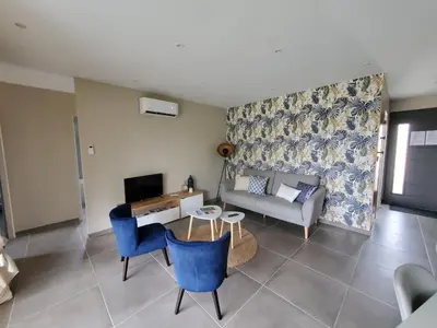 Coin salon dans l'établissement Gîte Lou, Gîte famille et bien être avec jacuzzi