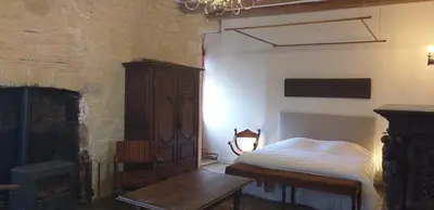 Un ou plusieurs lits dans un hébergement de l'établissement Chambre Renaissance au Château de Champagne-Mouton