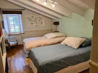 Un ou plusieurs lits dans un hébergement de l'établissement Domaine de la Basse Bobinière - Gîte et Chambres d'hôtes