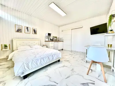 Un ou plusieurs lits dans un hébergement de l'établissement Studio - Le Marbre - aux portes du Futuroscope