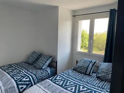 Un ou plusieurs lits dans un hébergement de l'établissement Appartement T2 proche du Futuroscope