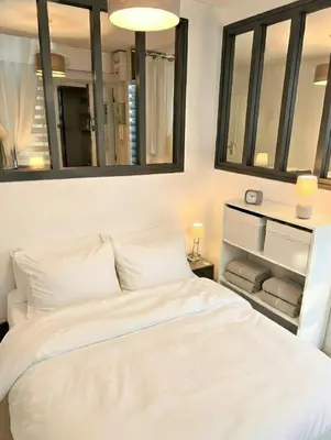 Un ou plusieurs lits dans un hébergement de l'établissement L'Oasis Marin lumineux et cosy à deux pas du vieux marché dans l'hyper centre de La Rochelle avec TV et Wifi