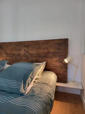 Un ou plusieurs lits dans un hébergement de l'établissement Appartement La verrerie, terrasse et jardinet
