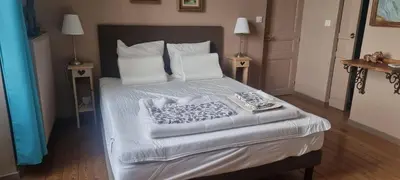 Un ou plusieurs lits dans un hébergement de l'établissement La Ferme des Augustines