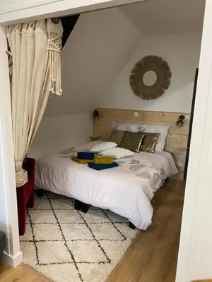 Un ou plusieurs lits dans un hébergement de l'établissement Cosy & Tendance Spa
