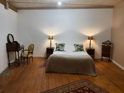 Un ou plusieurs lits dans un hébergement de l'établissement Gîte du château au pied de Cognac