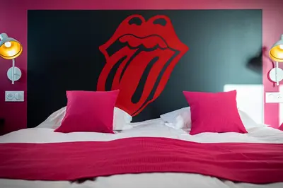 Un ou plusieurs lits dans un hébergement de l'établissement L'Auberge des Artistes