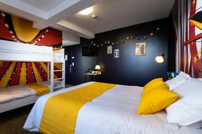 Un ou plusieurs lits dans un hébergement de l'établissement L'Auberge des Artistes