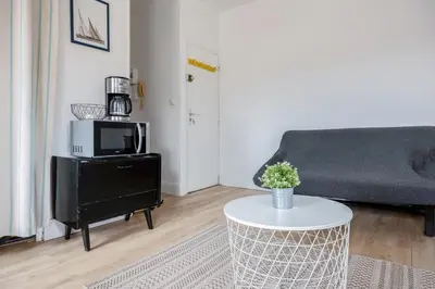 Coin salon dans l'établissement MYAPPARTLAROCHELLE