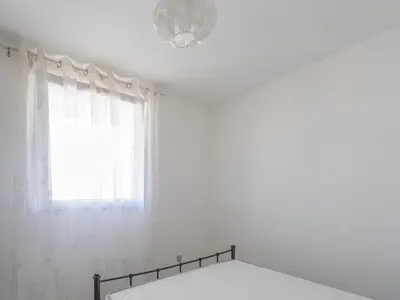 Un ou plusieurs lits dans un hébergement de l'établissement Appartement 4 Pers. Terrasse Clim, Piscine Collective - FR-1-258-203