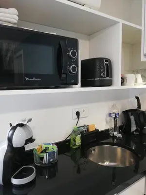 Cuisine ou kitchenette dans l'établissement Le 26