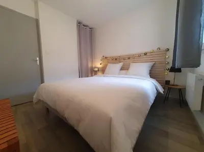 Un ou plusieurs lits dans un hébergement de l'établissement Dolce vita en centre ville