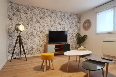 Télévision ou salle de divertissement dans l'établissement L'échappée Belle