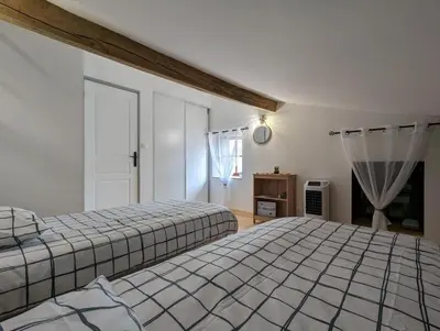 Un ou plusieurs lits dans un hébergement de l'établissement Gîte La Rive Gauche