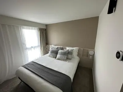 Un ou plusieurs lits dans un hébergement de l'établissement Hôtel Akena Chauray-Niort