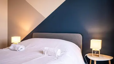 Un ou plusieurs lits dans un hébergement de l'établissement Le Montbernage - Beautiful modern apartment