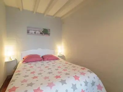 Un ou plusieurs lits dans un hébergement de l'établissement Holiday Home Gîte La Truffière Saintongeaise by Interhome