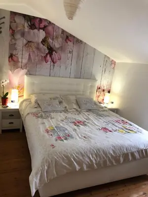 Un ou plusieurs lits dans un hébergement de l'établissement Grand gîte 14 personnes Sud Vendée