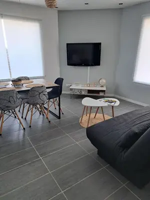 Télévision ou salle de divertissement dans l'établissement Maison proche la Rochelle