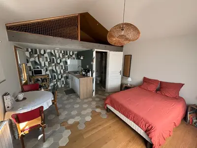 Un ou plusieurs lits dans un hébergement de l'établissement Studio des Lilas