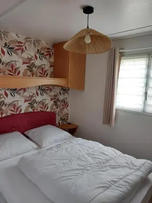 Un ou plusieurs lits dans un hébergement de l'établissement Camping du Nizour